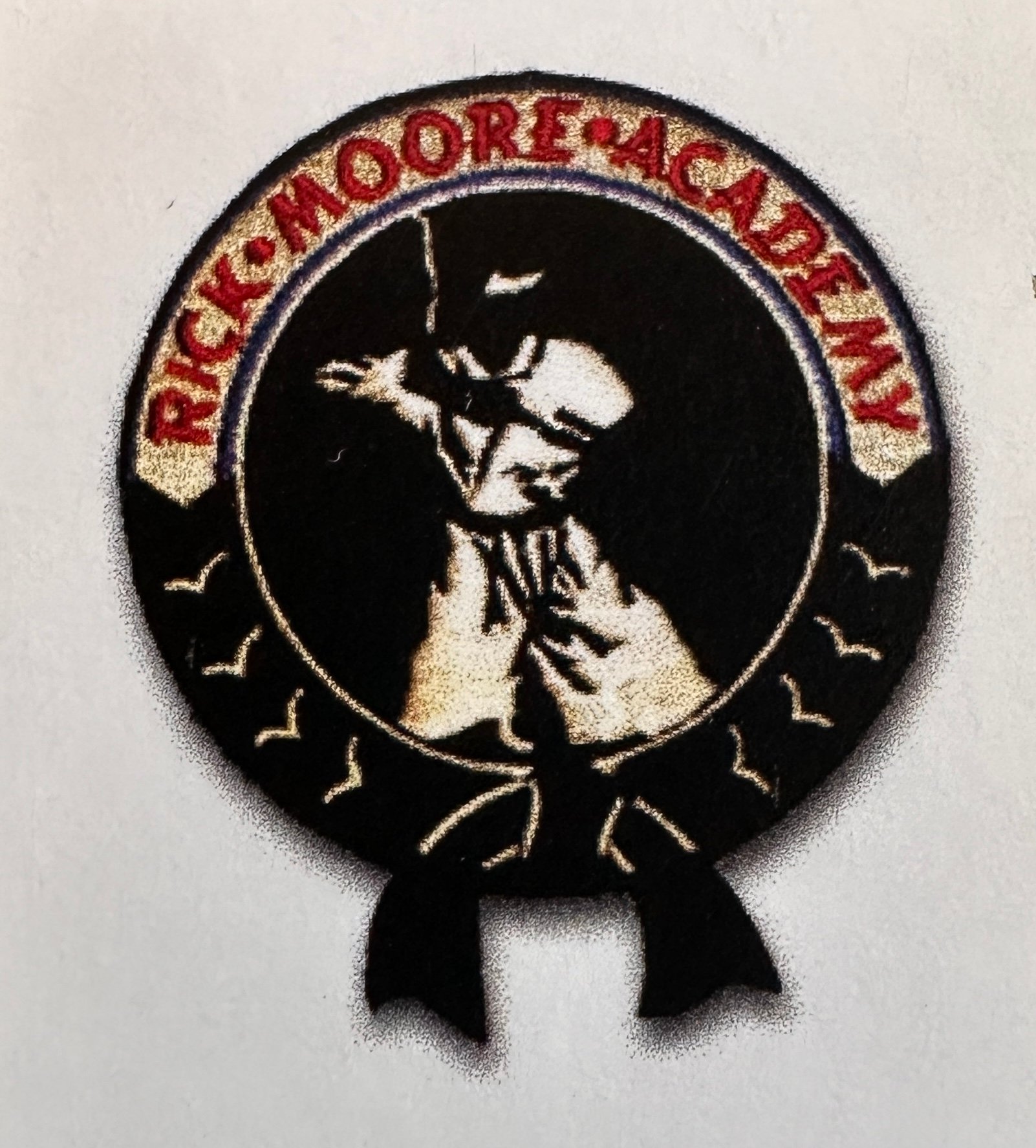 Rick Moore Academy logo